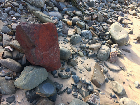 red stone, unusual stone, be bright, stand out from the crowdの写真素材