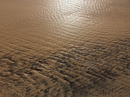 patterns created ?n the sand by waves and wind, sand pattern as backgroundの写真素材