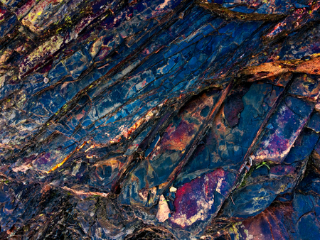 stone texture of amazing color, rocky layers of bright colorsの写真素材