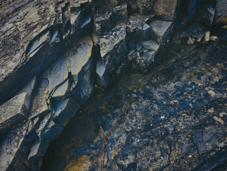 stone texture of amazing color, rocky layers of bright colorsの写真素材