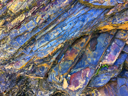 stone texture of amazing color, rocky layers of bright colorsの写真素材