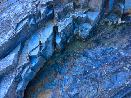 stone texture of amazing color, rocky layers of bright colorsの写真素材