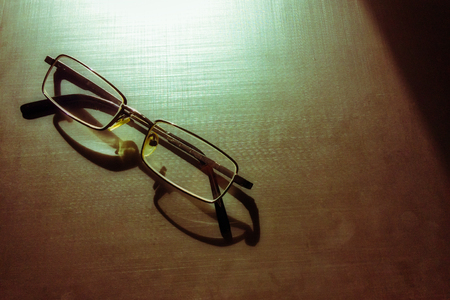 glasses on a dark background, shadow of the rim, metallic materialの写真素材
