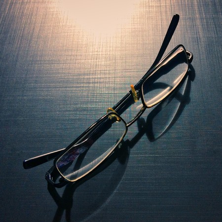 glasses on a dark background, shadow of the rim, metallic materialの写真素材