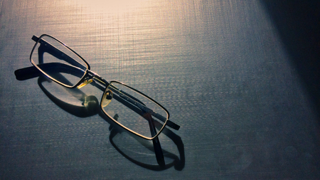 glasses on a dark background, shadow of the rim, metallic materialの写真素材