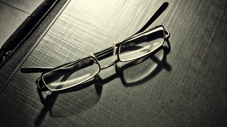glasses on a dark background, shadow of the rim, metallic materialの写真素材