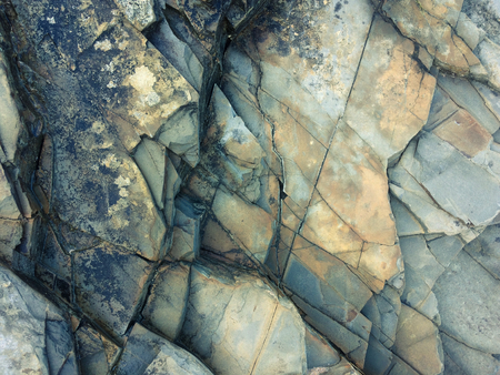 fractured rock strata as a background, cracked rock, stone texture, many cracks in the stone, fractured rockの写真素材