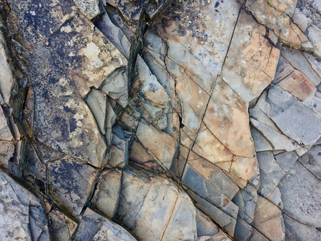 fractured rock strata as a background, cracked rock, stone texture, many cracks in the stone, fractured rockの写真素材