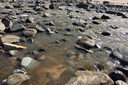 mountain stream, rapid flow of water, stones in the water, small mountain riverの写真素材