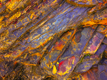 stone texture of amazing color, rocky layers of bright colorsの写真素材