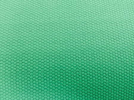 painted rubber as background, rough surface, green backgroundの写真素材