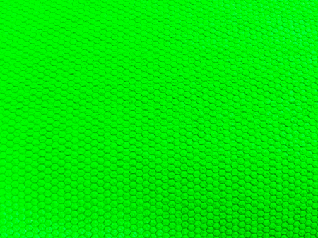 painted rubber as background, rough surface, green backgroundの写真素材