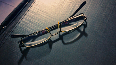 glasses on a dark background, shadow of the rim, metallic materialの写真素材