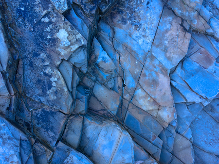 stone texture of amazing color, rocky layers of bright colorsの写真素材