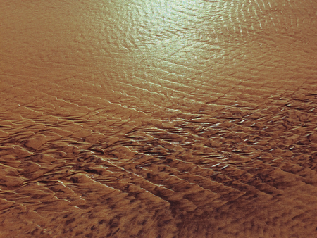 patterns created Ð¾n the sand by waves and wind, sand pattern as backgroundの写真素材