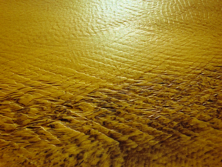 patterns created Ð¾n the sand by waves and wind, sand pattern as backgroundの写真素材