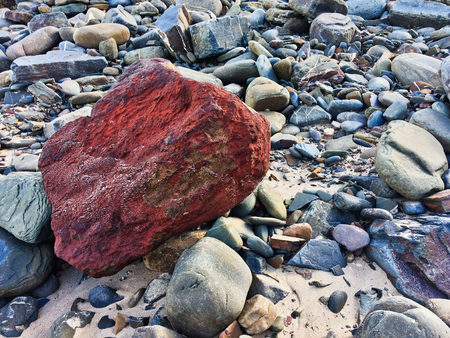 red stone, unusual stone, be bright, stand out from the crowdの写真素材