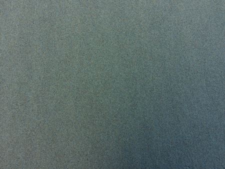 wet sand as a background, sand texture of an unusual colorの写真素材