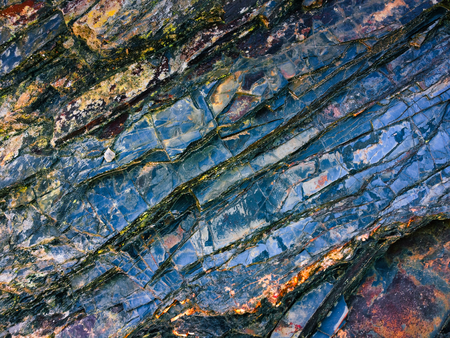stone texture of amazing color, rocky layers of bright colorsの写真素材