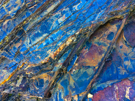 stone texture of amazing color, rocky layers of bright colorsの写真素材