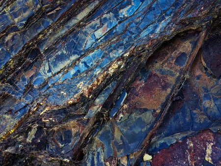 stone texture of amazing color, rocky layers of bright colorsの写真素材
