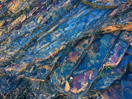 stone texture of amazing color, rocky layers of bright colorsの写真素材