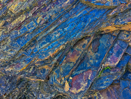 stone texture of amazing color, rocky layers of bright colorsの写真素材