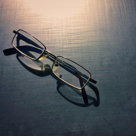 glasses on a dark background, shadow of the rim, metallic materialの写真素材