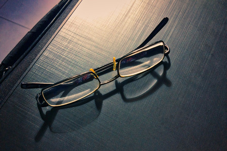 glasses on a dark background, shadow of the rim, metallic materialの写真素材