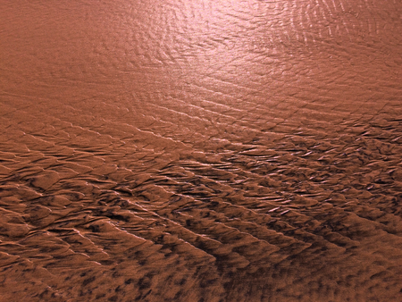 patterns created Ð¾n the sand by waves and wind, sand pattern as backgroundの写真素材