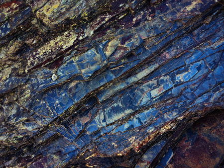 stone texture of amazing color, rocky layers of bright colorsの写真素材
