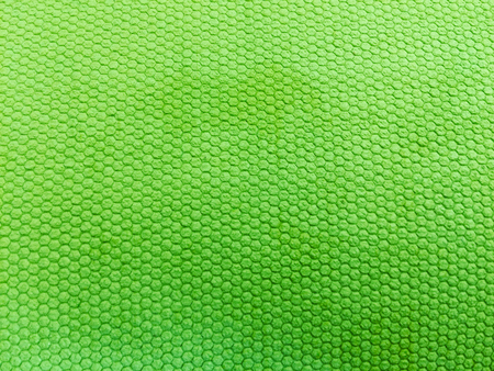 painted rubber as background, rough surface, green backgroundの写真素材