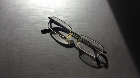 glasses on a dark background, shadow of the rim, metallic materialの写真素材