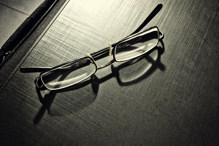 glasses on a dark background, shadow of the rim, metallic materialの写真素材