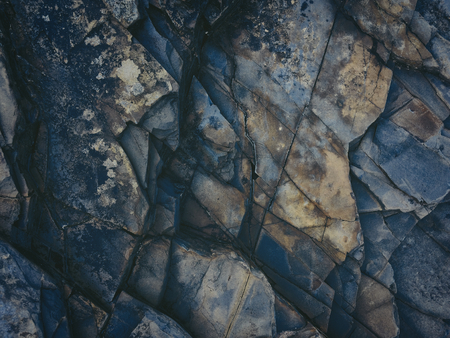 stone texture of amazing color, rocky layers of bright colorsの写真素材