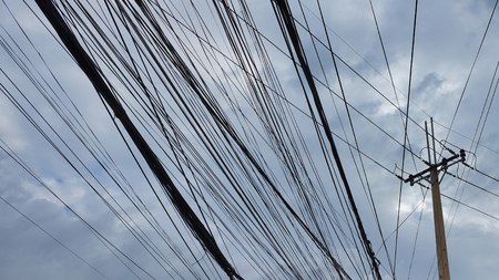 power line pylon, concrete pole and urban communications wiresの写真素材