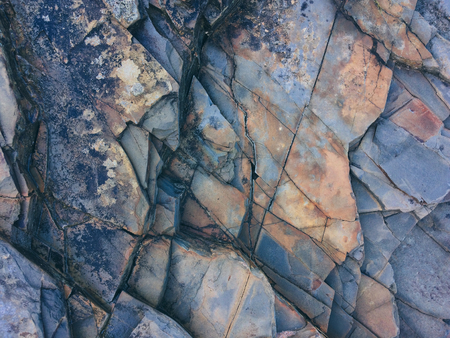 stone texture of amazing color, rocky layers of bright colorsの写真素材