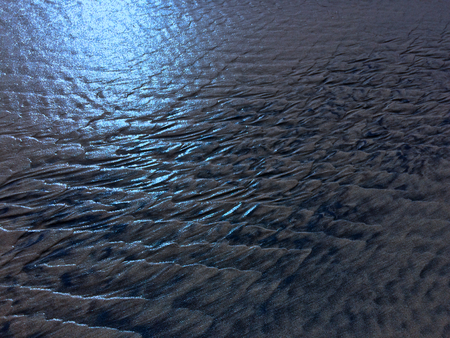patterns created Ð¾n the sand by waves and wind, sand pattern as backgroundの写真素材