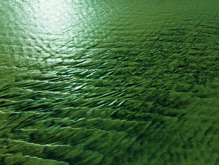 patterns created Ð¾n the sand by waves and wind, sand pattern as backgroundの写真素材