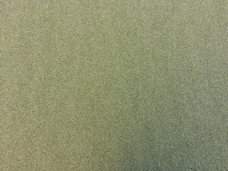 wet sand as a background, sand texture of an unusual colorの写真素材