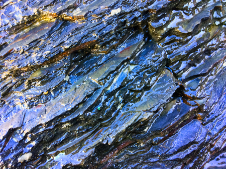 wet rock, stone formations as a backgroundの写真素材