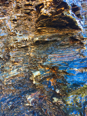 wet rock, stone formations as a backgroundの写真素材