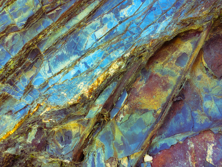 stone texture of amazing color, rocky layers of bright colorsの写真素材
