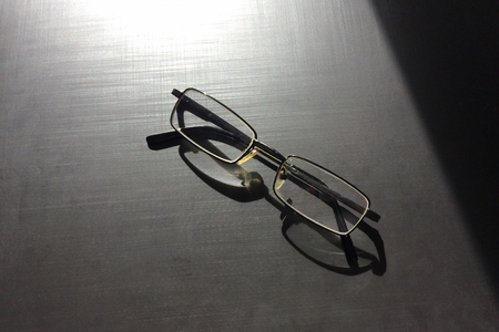 glasses on a dark background, shadow of the rim, metallic materialの写真素材
