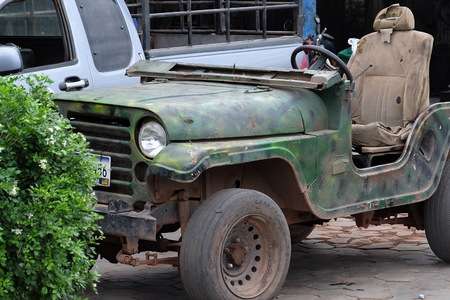 Cambodia, Siem Reap 12/08/2018 old collapsing car, army truck in the parking lotの写真素材