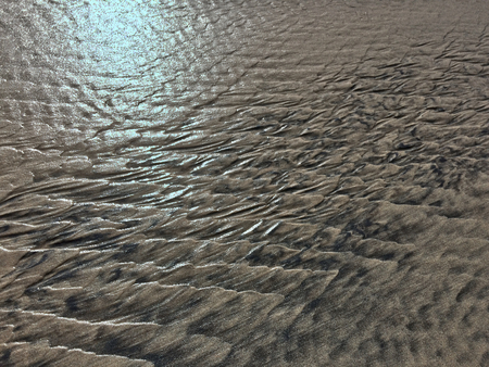patterns created Ð¾n the sand by waves and wind, sand pattern as backgroundの写真素材