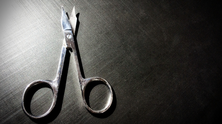small nail scissors on a dark background, nail scissors, small scissors, dark backgroundの写真素材