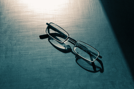glasses on a dark background, shadow of the rim, metallic materialの写真素材