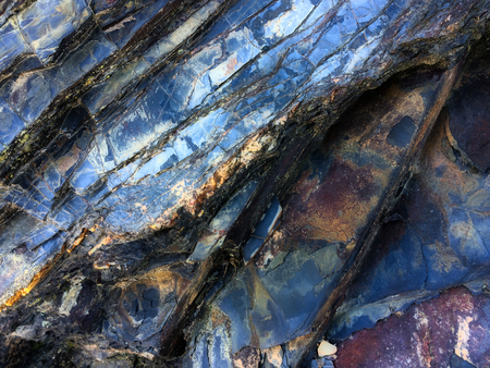 stone texture of amazing color, rocky layers of bright colorsの写真素材