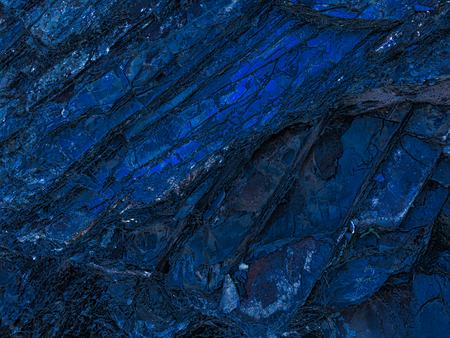 stone texture of amazing color, rocky layers of bright colorsの写真素材